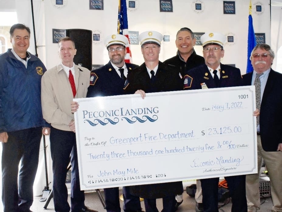 After the race, Peconic Landing President and CEO Robert J. Syron, alongside Suffolk County Legislator Al Krupski, Southold Town Supervisor Scott Russell, and Greenport Village Mayor George Hubbard Jr., presented the Older American Champion Award.