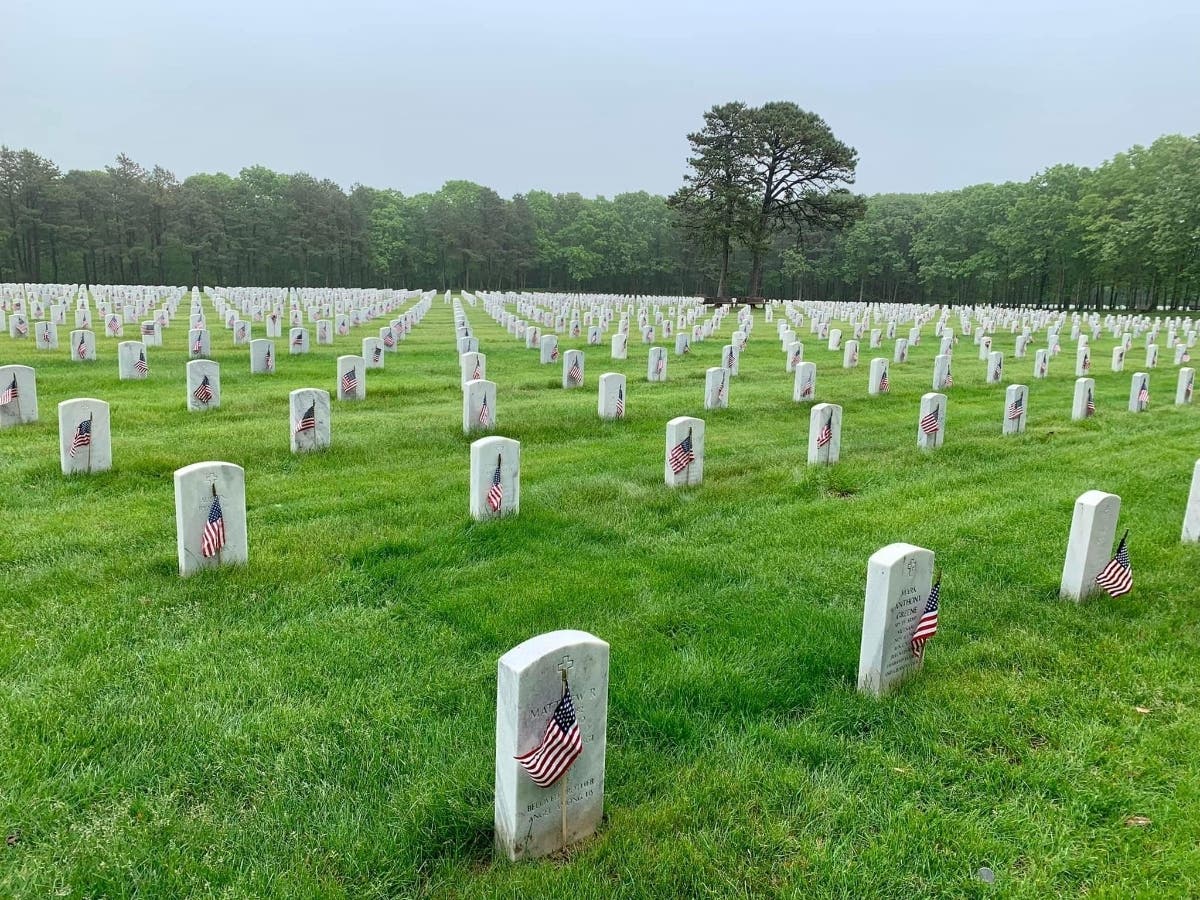 Hundreds of flags were placed by Scouts at gravesites at Calverton National Cemetery.