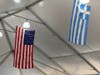 The Greek and American flags flew side by side