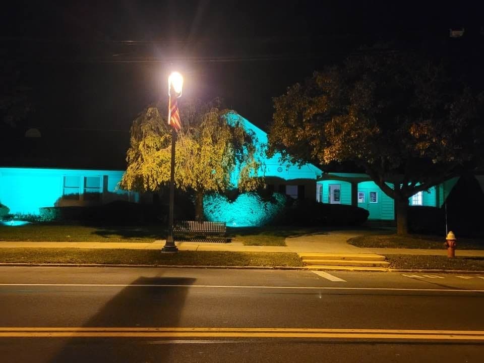 Southold Town Hall was illuminated in green Monday night, on the eve of Dylan Newman's funeral service.