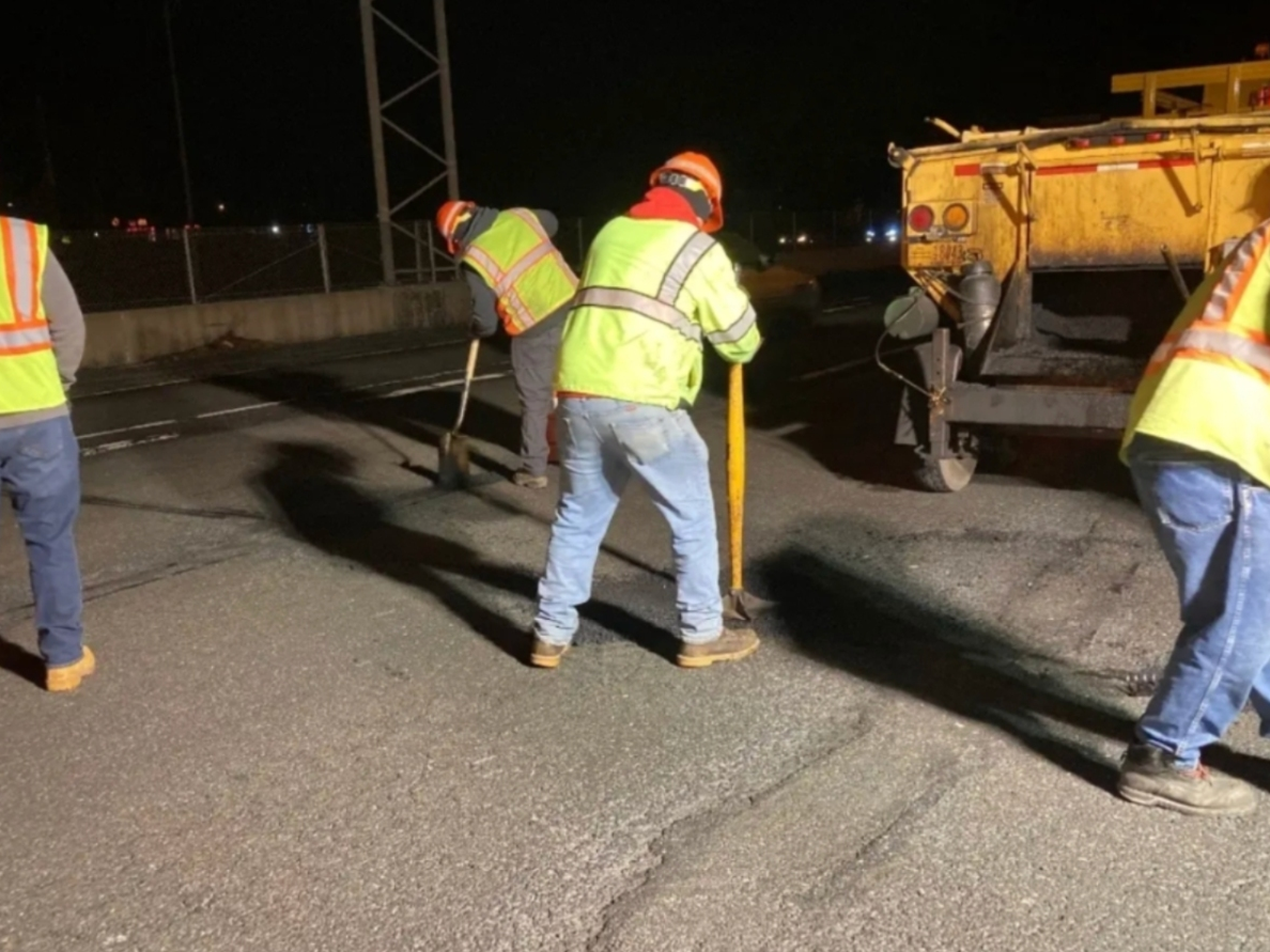 New York State Department of Transportation workers repairing potholes on Sunrise Highway this year as complaints from residents about worsening road conditions intensified.
