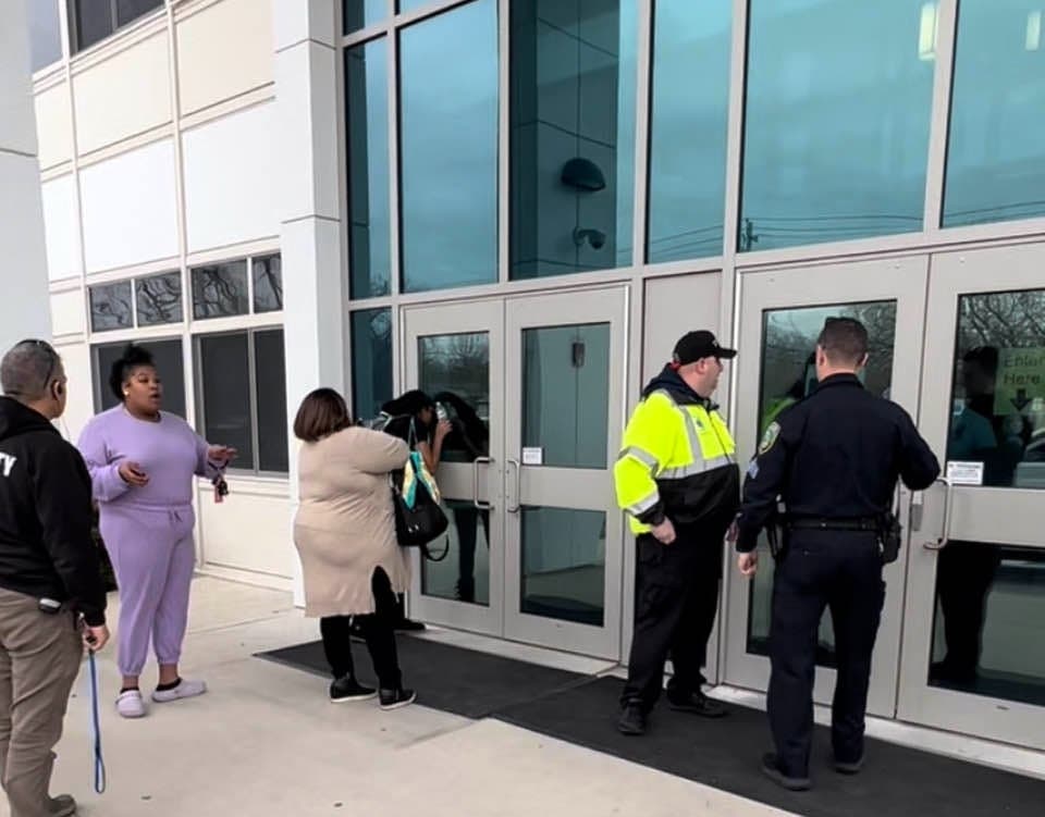 Terrified parents outside Riverhead High School Friday, pleading to be allowed to get to their children.