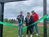 A ribbon-cutting ceremony was held to donate the scoreboard to Dylan Newman.