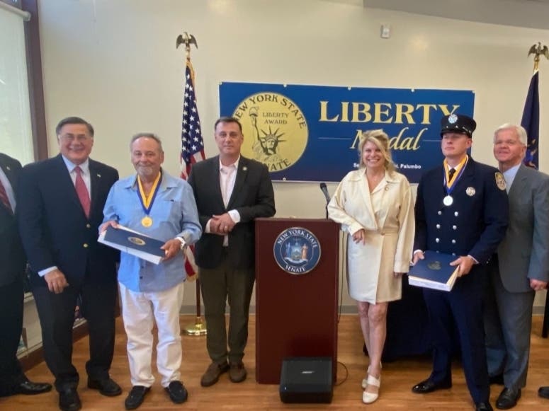 "It is my great honor to award these three men with the highest civilian award available by the New York State Senate."