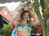 An elated adult mermaid claimed her prize as winner of the adult costume competition.