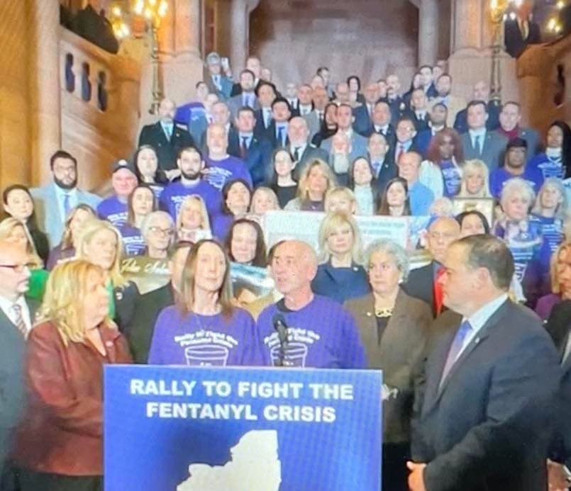 Carrying signs and photos of the lost, families demanded change in Albany Monday.