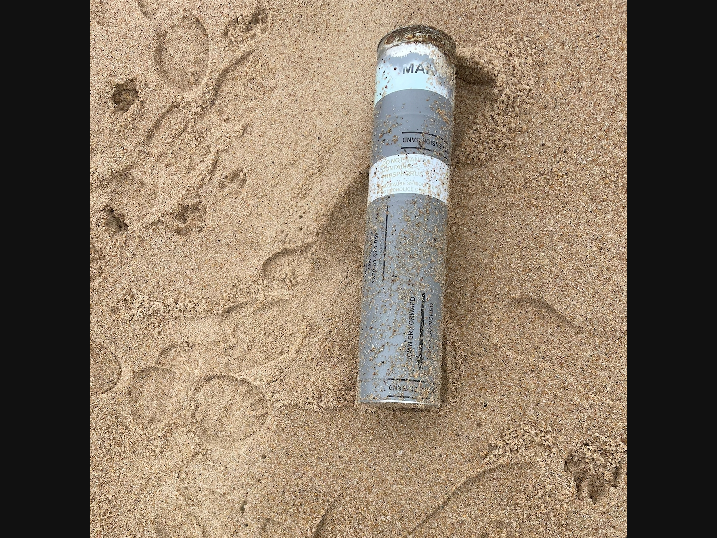 The canister was found on an East Hampton beach Sunday, police said.