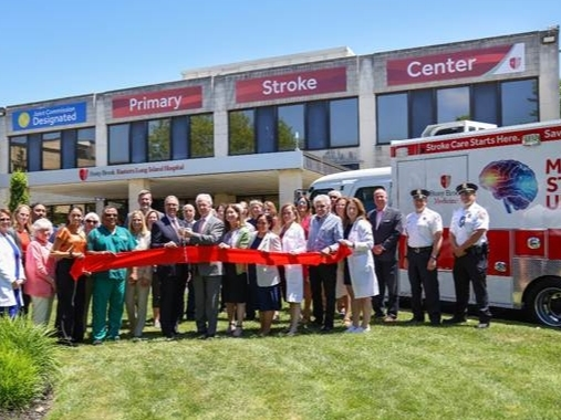 William Wertheim, executive vice president of Stony Brook Medicine, and Paul J. Connor, III, chief administrative officer, Stony Brook Eastern Long Island Hospital, joined by Stony Brook Eastern Long Island Hospital leadership,officials at ribbon-cutting.