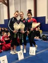 Seniors competing in their last home meet were Gianna Cardini, Kelsey Fedorko and Kaitlyn Moussignac of New Canaan.