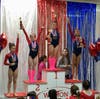 Darien YMCA Level 4 gymnasts swept the All-Around podium for the 8-9 age group with Jacquelyn Coppola placing first, Cou