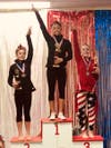 Darien Level 8 gymnasts Leilani Nguyen and Tori Ware placed first and second in the All Around for their age group at th