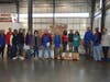 Volunteers from Griffin Health, TEAM, Inc. and Better Packages, Inc. get ready to separate pallets of food.