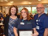 Griffin Health Multi-Skilled Technician Jude Aquila, of New Haven, center, received the Donald Torok Memorial Scholarship Award at Griffin’s 37th Annual Nurses Week Celebration from award presenter Linda Torok and Griffin Health Nurse Michael Montefusco.