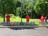 Three employees of Chestnut Knoll and members of the Boyertown Area High School Class of 2020, Amy Hansen, Madison Denneney and Amanda Garvey, pose in front of the Heroes Work Here sign on the lawn at the senior living community in Boyertown.