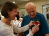 Sandy Niermans pins a boutonniere to her father’s shirt, Chestnut Knoll resident Ernest Knechel. His late wife, Mildred, was remembered during a vow renewal ceremony held at the senior living community in Boyertown on Valentine’s Day.