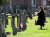 America250! Committee Chair Lindsay Bensenhaver checking the list and the gravestones needed for pictures.