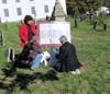 Melissa Conti and Pat King checking the map while Jeaneen Buchanan looks on.