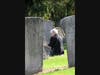 Honorary Chapter Regent Patricia King checking the grave stone needed for a picture