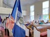 SRH-MS Chapter, NSDAR Chaplain Cheryl Basztura carrying flag with Regent Jeaneen Buchanan walking behind.