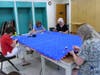 Jeaneen Buchanan, Marion Osborne, Claudia Farkas and Linda Papp sewing on binding