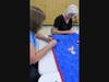 Marion Osborne and Claudia Farkas sewing the binding