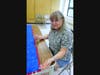 Linda Papp sewing the binding