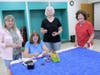 Linda Papp, Marion Osborne, Claudia Farkas, Jeaneen Buchanan hemming on binding