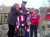 Quilters Marion Osborne and Linda Papp drape the Quilt of Valor over Joel Hurliman's shoulders at the Sutter-Terlizzi American Legion Post 16 on Veterans Day