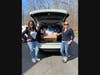 Getting ready to unload 85 Easter Baskets is Kim DiMatteo of Bethany, left, founder of the Easter Basket Drive and Kim LaChance of Prospect, right.