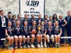 The Lady Bobcats from Immanuel Lutheran School, in Palatine, pose for a team photo after winning its fifth consecutive LSA Illinois State Girls’ Basketball Championship on March 8th, in Arlington Heights, Ill. 