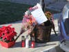 A makeshift memorial was erected outside the Riverside home where three people died.
