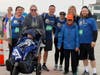 Team LADACIN coordinator Joe Walker (center) with family and friends at finish line