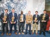 Ben Avila standing with other award recipients at Halas Hall