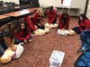 Bremen Child Care 2 Students Learning CPR in class at Bremen High School