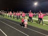 Community members looked onto the Oak Forest High School cheerleading and POMs teams who dressed in pink.