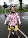 Lucy Hammond rides her bike around the area while her mom, Debbie Hammond, helps hide Easter eggs. 