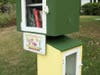 The Little Free Library at 142 Porter Drive has expanded. Now it has a green library for adult books and a yellow library for children.