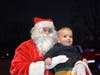 Admiral Heights resident Zaid Hyali sits on Santa’s lap during the Santa Run.