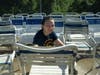 Elaine Jeffery cleans a chair at the annual swimming pool cleanup in Admiral Heights.