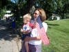 Jennie Heisterman and her grandson, Luca Albanese, stake out a prime spot for watching the children’s Fourth of July bike parade in Admiral Heights.

