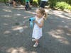 Whitney Wood makes bubbles at a Fourth of July bike parade. 

