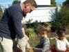 From left, the Heiers – John, Chelsea and Kyleigh -- work together to make a scarecrow.