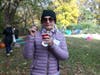 Barbara Halliwell enjoys some candy and hot apple cider at the Admiral Heights block party.