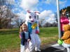 Harper Thibodeau poses with the Easter bunny (JJ Davies). Standing in the background with her Easter headgear is JJ’s mom, Jenni Davies.