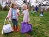 Lucy Gats, left, and Whitney Wood show off some of the Easter eggs they’ve found. 