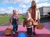 Sisters, Rosie, left, and Stella Ziliox, help their cousin, Theo Good, hunt for Easter eggs.