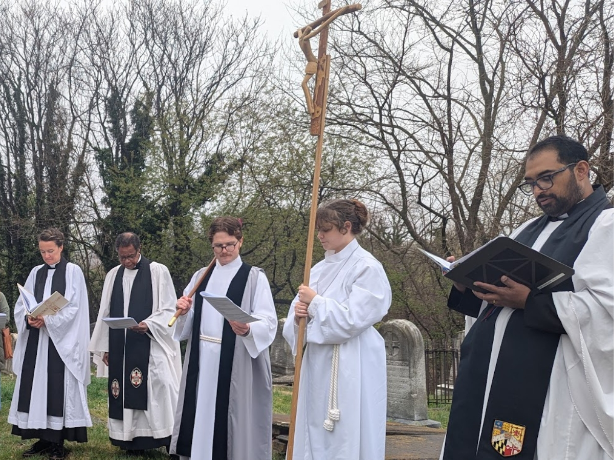 Caleb Briggs, Verger, and Magnolia Vandiver, Acolyte, with St. Anne’s Clergy at the Stations of the Cross Service on Good Friday