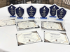 Highlight of the afternoon: recipients proudly displaying all trophies and certificates awarded in 2025.