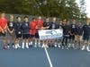 The Brookline boys tennis hold the Division 1 South Sectional championship banner.