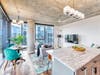 KItchen island and living room of an apartment at Avidor Evanston.